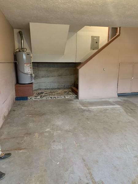 1707 University Dr, Columbia, TN 38401 - basement with gas water heater, a textured ceiling, and electric panel