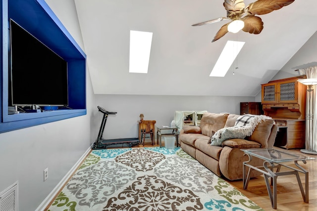 1707 University Dr, Columbia, TN 38401 - living area with a skylight, vaulted ceiling, wood finished floors, and ceiling fan