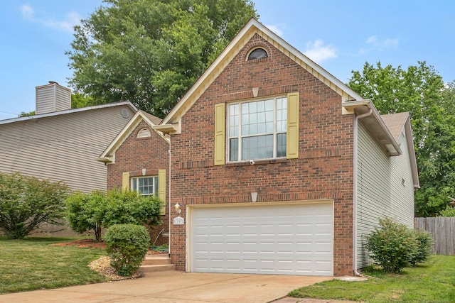 1707 University Dr, Columbia, TN 38401 - traditional-style house with a garage, driveway, and brick siding