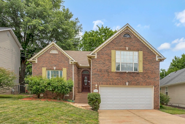 1707 University Dr, Columbia, TN 38401 - view of front of house with a garage, brick siding, a front lawn, and concrete driveway