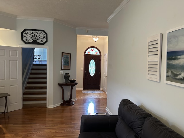1707 University Dr, Columbia, TN 38401 - entryway featuring wood finished floors, ornamental molding, and stairway