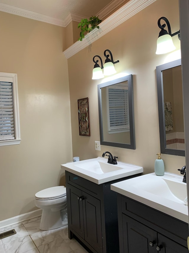 1707 University Dr, Columbia, TN 38401 - bathroom with two vanities, marble finish flooring, and crown molding