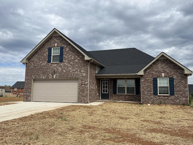 3358 Curie Cir, Christiana, TN 37037 - traditional-style home featuring an attached garage, driveway, brick siding, and a shingled roof