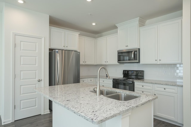 3419 Deerchase Cir, Murfreesboro, TN 37129 - kitchen featuring appliances with stainless steel finishes, white cabinetry, dark wood finished floors, a center island with sink, and recessed lighting