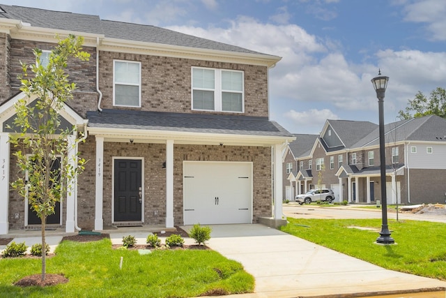 3419 Deerchase Cir, Murfreesboro, TN 37129 - view of front facade with concrete driveway, a front yard, an attached garage, and brick siding
