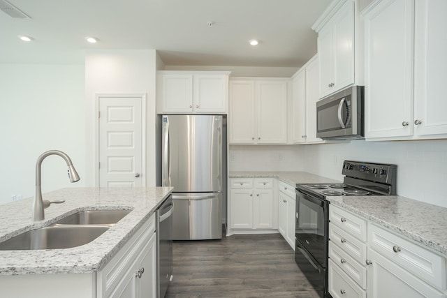 3419 Deerchase Cir, Murfreesboro, TN 37129 - kitchen with stainless steel appliances, white cabinets, dark wood-style floors, light stone countertops, and recessed lighting