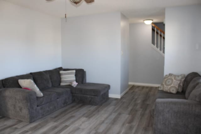 1969 Whirlaway Cir, Clarksville, TN 37042 - living area featuring wood finished floors, ceiling fan, and stairway