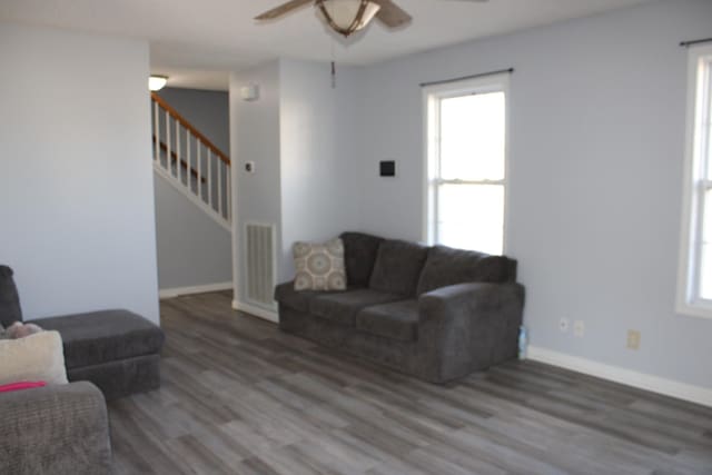 1969 Whirlaway Cir, Clarksville, TN 37042 - living area featuring a ceiling fan, wood finished floors, plenty of natural light, and stairs