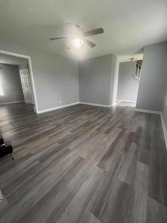 1969 Whirlaway Cir, Clarksville, TN 37042 - empty room with a ceiling fan, dark wood-style floors, and a textured ceiling