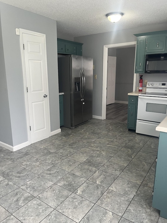 1969 Whirlaway Cir, Clarksville, TN 37042 - kitchen featuring electric range, black microwave, stainless steel fridge with ice dispenser, light countertops, and a textured ceiling