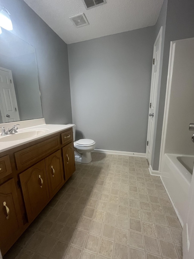 1969 Whirlaway Cir, Clarksville, TN 37042 - full bathroom with vanity, a textured ceiling, a tub, and tile patterned floors