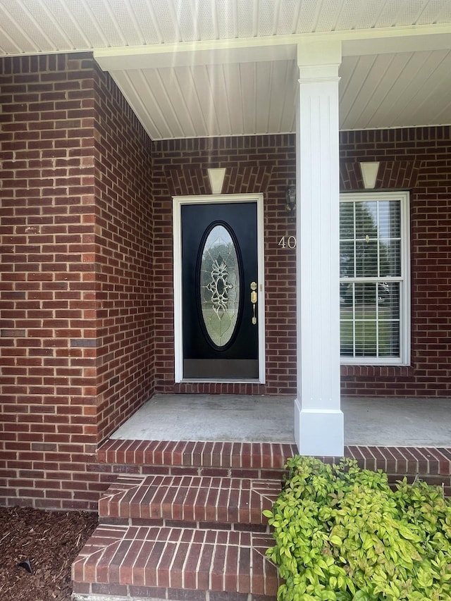 407 Robins St, Lawrenceburg, TN 38464 - entrance to property featuring brick siding and a porch