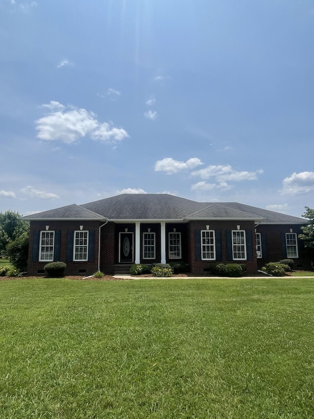 407 Robins St, Lawrenceburg, TN 38464 - ranch-style house featuring brick siding and a front lawn