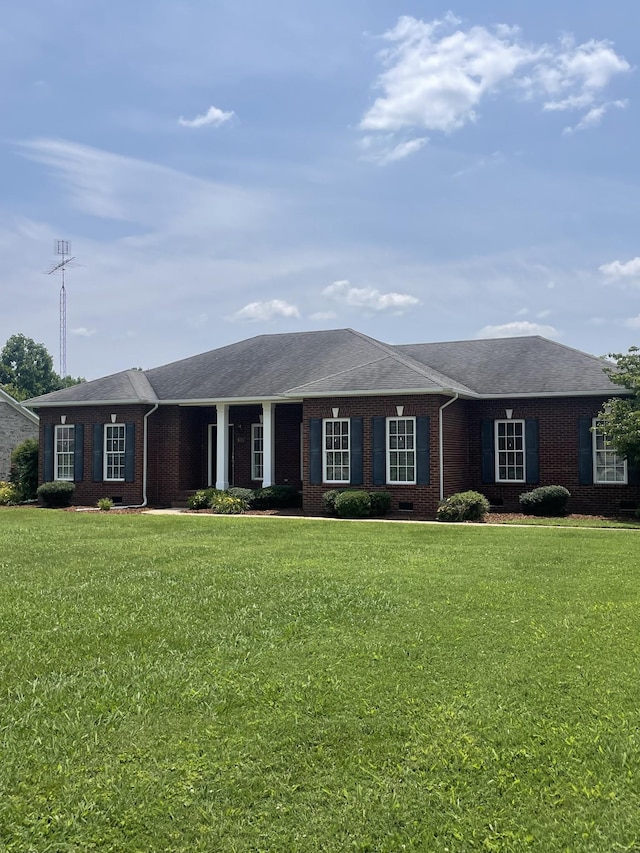 407 Robins St, Lawrenceburg, TN 38464 - ranch-style house featuring brick siding, a front yard, and roof with shingles