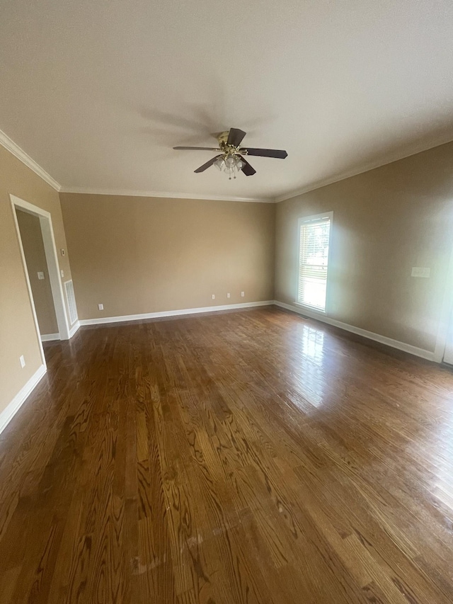 407 Robins St, Lawrenceburg, TN 38464 - empty room with ornamental molding, ceiling fan, and dark wood finished floors