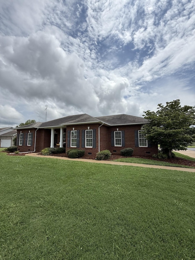 407 Robins St, Lawrenceburg, TN 38464 - ranch-style house featuring brick siding, a front yard, and a shingled roof
