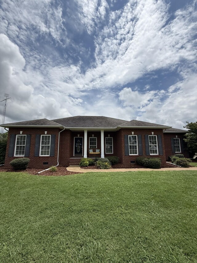 407 Robins St, Lawrenceburg, TN 38464 - single story home featuring brick siding, a front yard, and crawl space