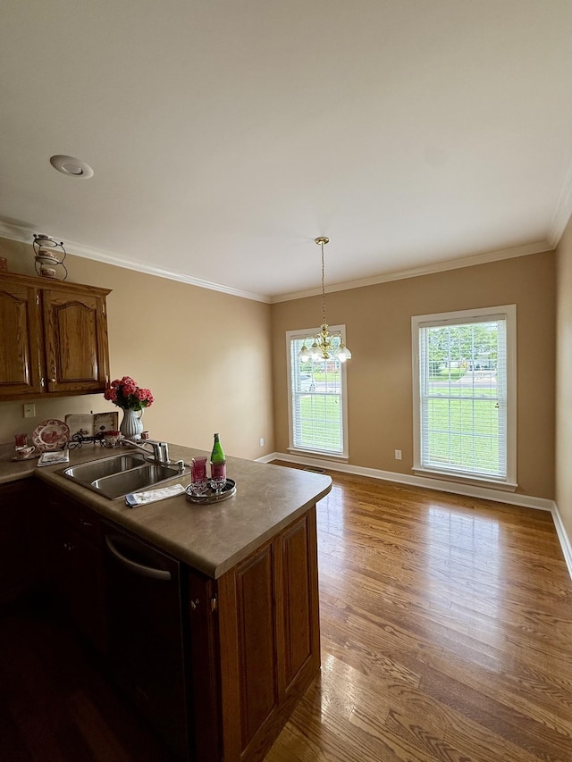 407 Robins St, Lawrenceburg, TN 38464 - kitchen featuring dishwashing machine, wood finished floors, ornamental molding, a peninsula, and a chandelier