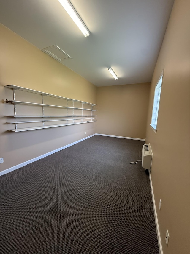 407 Robins St, Lawrenceburg, TN 38464 - carpeted empty room featuring baseboards and a wall mounted air conditioner