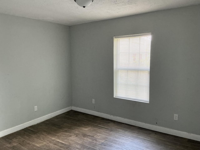 1904 E 31st Street Pl, Chattanooga, TN 37407 - spare room with dark wood-style flooring and a textured ceiling