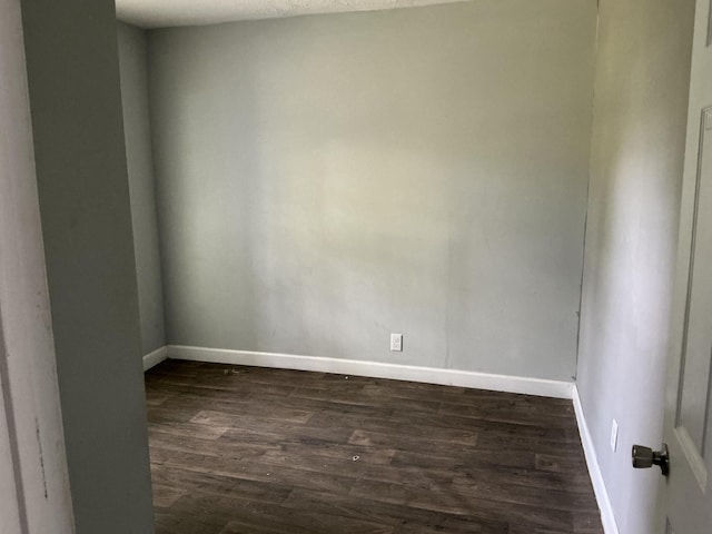 1904 E 31st Street Pl, Chattanooga, TN 37407 - empty room with dark wood-style floors and baseboards