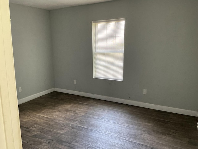 1904 E 31st Street Pl, Chattanooga, TN 37407 - spare room featuring baseboards and dark wood-style floors