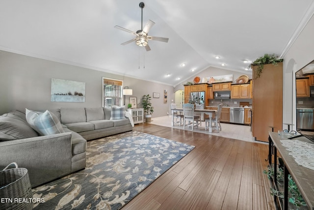 8012 Campbells Point Rd, Corryton, TN 37721 - living area featuring ceiling fan, lofted ceiling, light wood-style flooring, crown molding, and arched walkways