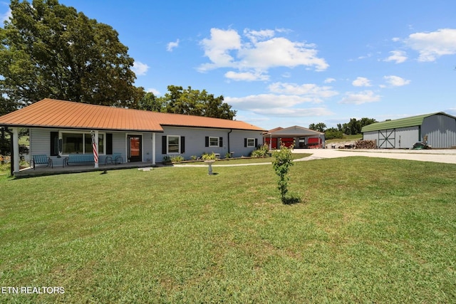 1016 Swan Pond Circle Rd, Harriman, TN 37748 - single story home with covered porch, a front lawn, concrete driveway, and an outdoor structure