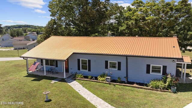 1016 Swan Pond Circle Rd, Harriman, TN 37748 - view of front of house featuring a front yard, a metal roof, and covered porch