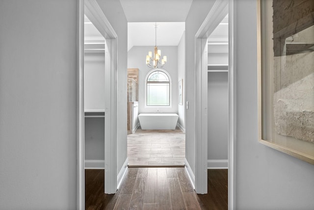 1150 Reda Dr, Clarksville, TN 37042 - corridor featuring dark wood-type flooring, a chandelier, and vaulted ceiling