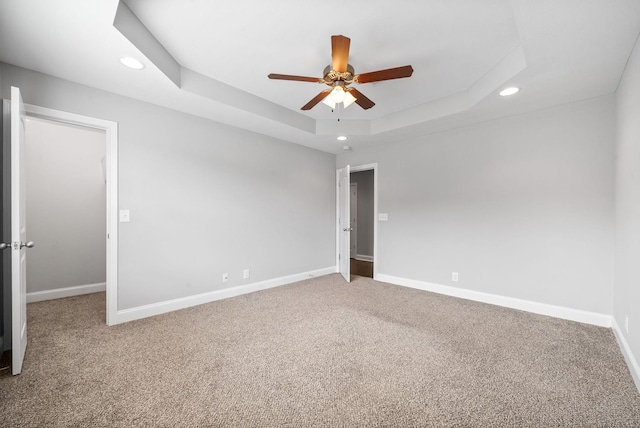 1150 Reda Dr, Clarksville, TN 37042 - empty room featuring recessed lighting, a ceiling fan, a tray ceiling, and carpet flooring