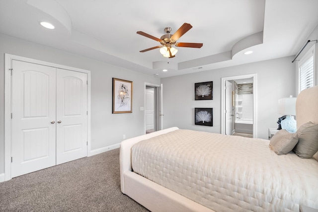 1150 Reda Dr, Clarksville, TN 37042 - carpeted bedroom featuring a tray ceiling, recessed lighting, a closet, a ceiling fan, and ensuite bath