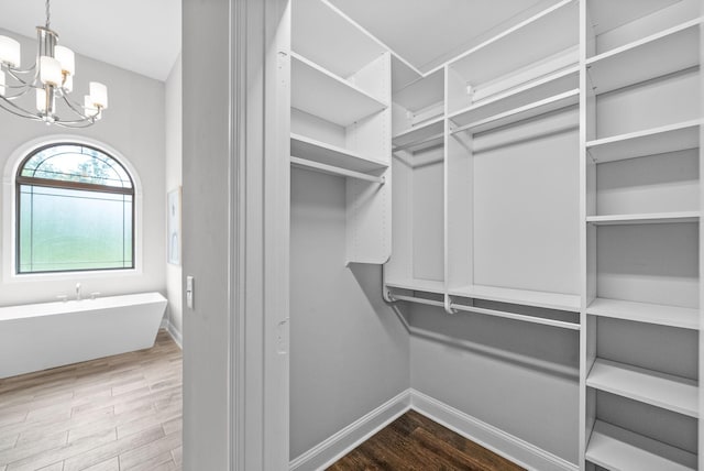 1150 Reda Dr, Clarksville, TN 37042 - spacious closet featuring a chandelier and wood finished floors