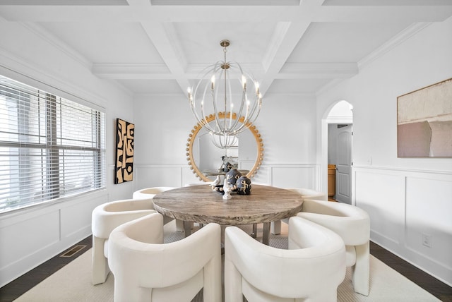 1150 Reda Dr, Clarksville, TN 37042 - dining space featuring arched walkways, a chandelier, beam ceiling, coffered ceiling, and dark wood-type flooring