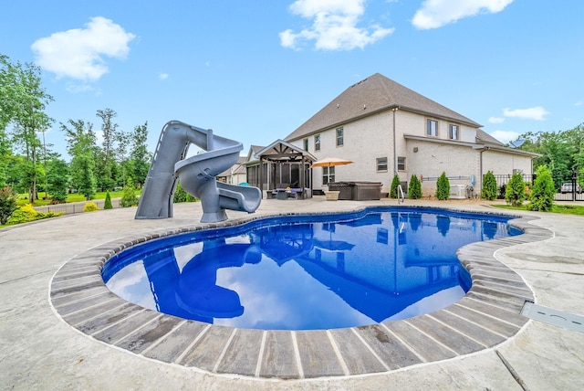 1150 Reda Dr, Clarksville, TN 37042 - view of pool featuring a hot tub, a water slide, and a patio
