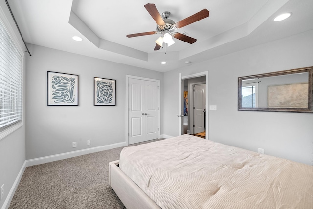 1150 Reda Dr, Clarksville, TN 37042 - bedroom with recessed lighting, a tray ceiling, carpet, a closet, and a ceiling fan