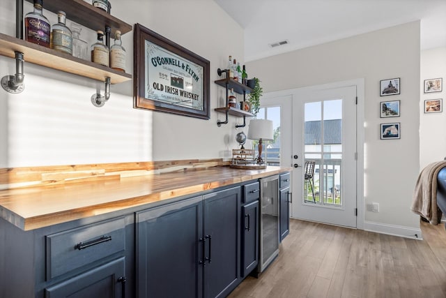 8069 Honeycomb Ln, Chattanooga, TN 37421 - bar area with beverage cooler and light wood-style floors