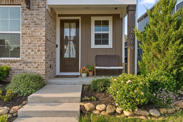 8069 Honeycomb Ln, Chattanooga, TN 37421 - view of exterior entry with board and batten siding and brick siding