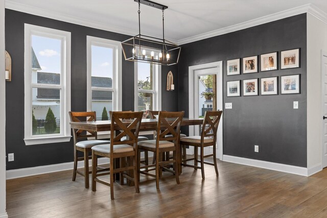 8069 Honeycomb Ln, Chattanooga, TN 37421 - dining area with crown molding, a chandelier, and dark wood-style floors