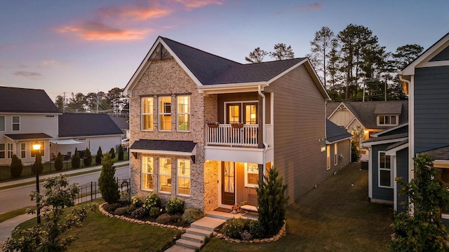 8069 Honeycomb Ln, Chattanooga, TN 37421 - craftsman inspired home with brick siding, a balcony, french doors, and a shingled roof