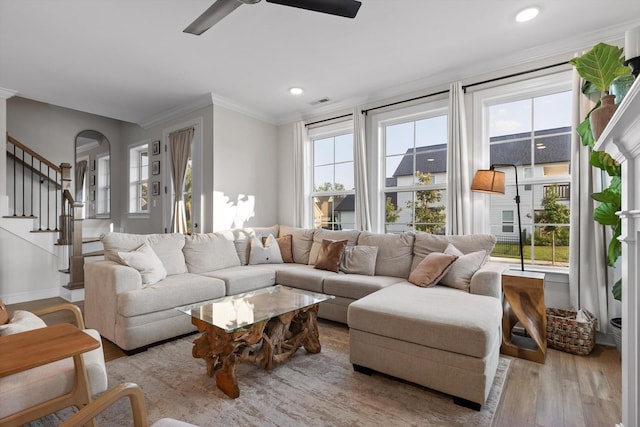 8069 Honeycomb Ln, Chattanooga, TN 37421 - living area featuring wood finished floors, a ceiling fan, stairs, crown molding, and recessed lighting