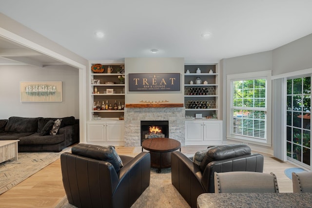 1209 Habersham Way, Franklin, TN 37067 - living area featuring wood finished floors, built in shelves, a stone fireplace, and recessed lighting