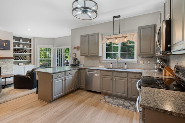 1209 Habersham Way, Franklin, TN 37067 - kitchen featuring appliances with stainless steel finishes, gray cabinets, light wood-type flooring, and a peninsula