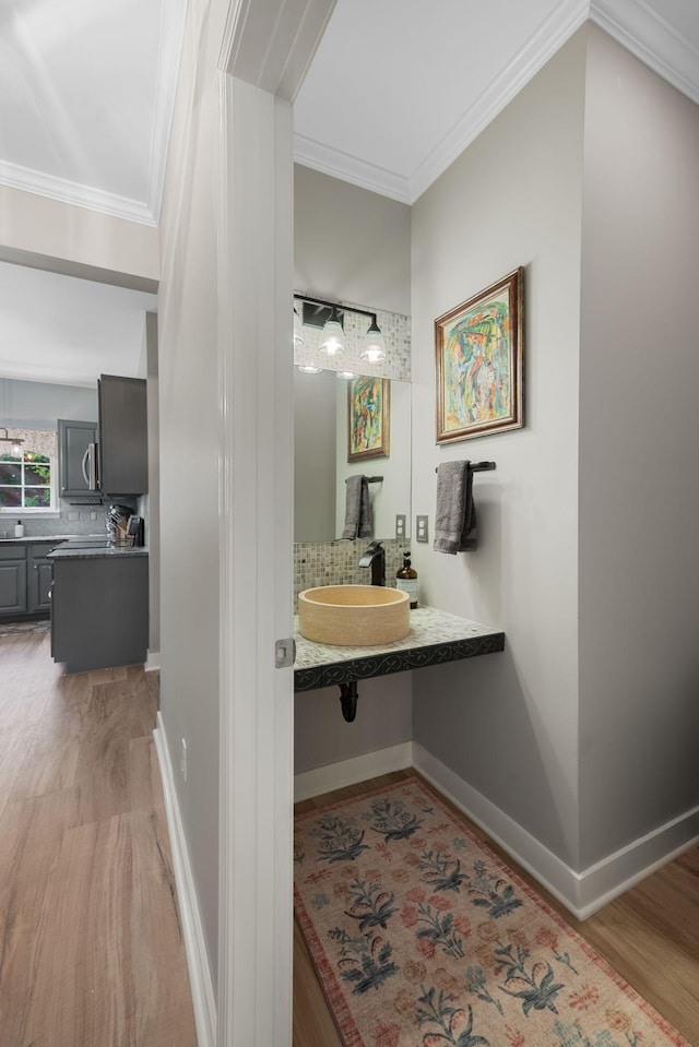 1209 Habersham Way, Franklin, TN 37067 - bathroom with decorative backsplash, wood finished floors, and ornamental molding