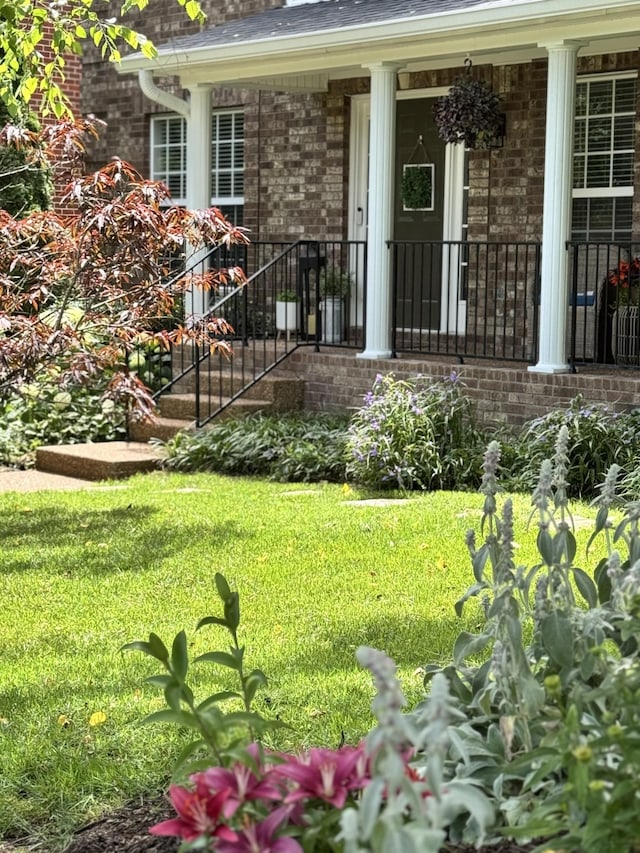 1209 Habersham Way, Franklin, TN 37067 - entrance to property with brick siding, a yard, a porch, and roof with shingles