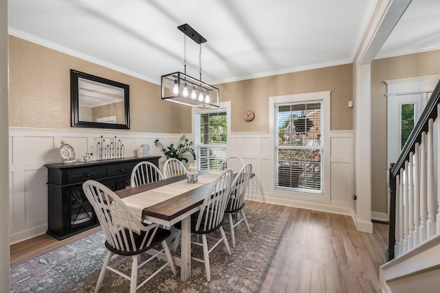 1209 Habersham Way, Franklin, TN 37067 - dining room featuring wood finished floors, a decorative wall, stairs, a wainscoted wall, and crown molding
