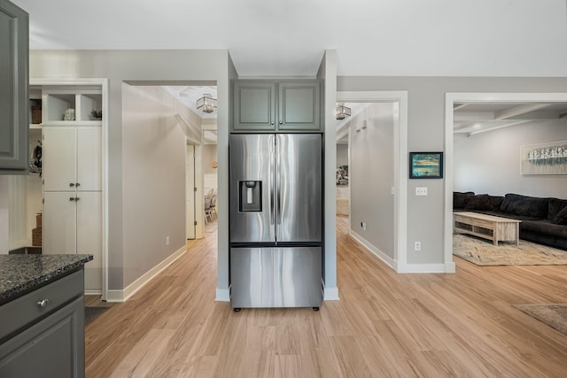 1209 Habersham Way, Franklin, TN 37067 - kitchen featuring stainless steel fridge, light wood-style flooring, dark stone counters, and gray cabinetry