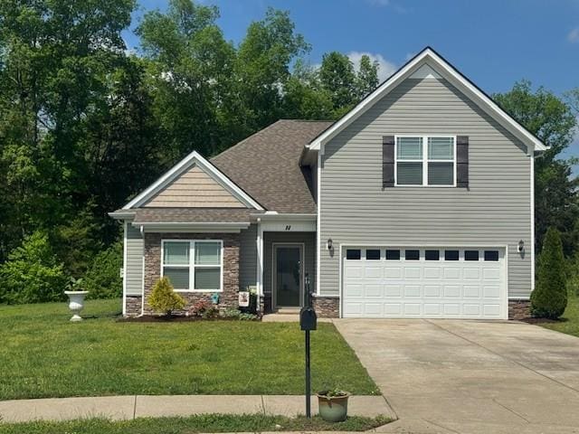 208 Fount Hackney Ln, Murfreesboro, TN 37129 - view of front facade featuring concrete driveway, a garage, stone siding, and a front lawn