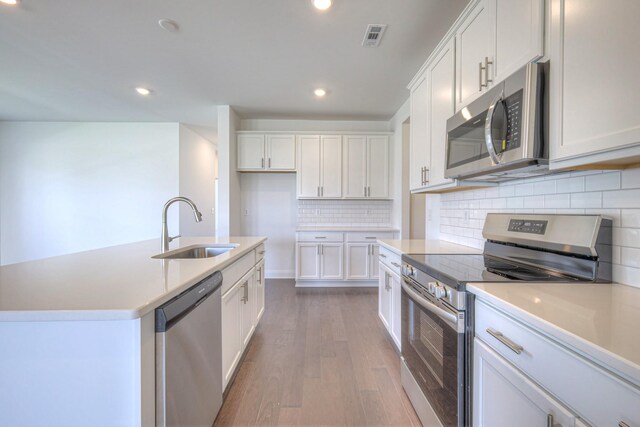 3600 Elene Way, Murfreesboro, TN 37129 - kitchen featuring stainless steel appliances, wood finished floors, white cabinetry, recessed lighting, and light countertops