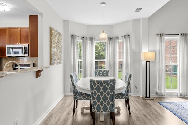 2003 Solomon Ct, Spring Hill, TN 37174 - dining room featuring light wood-style flooring and plenty of natural light